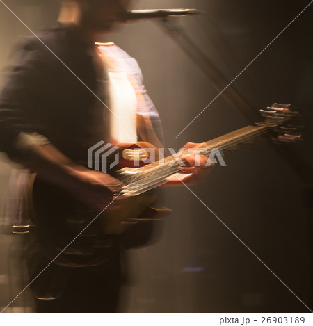 Blurred electric guitar player Blurred electric guitar player 26903189