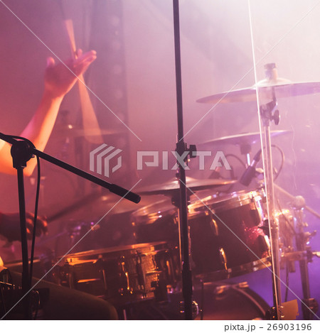 Drummer plays with drumstick 26903196