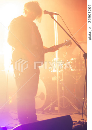 Blurred silhouette of guitar player Blurred silhouette of guitar player 26903206