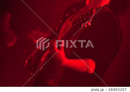 Electric guitar player in red lights Electric guitar player in red lights 26903207