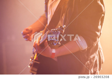 Electric guitar player close up photo Electric guitar player close up photo 26903208