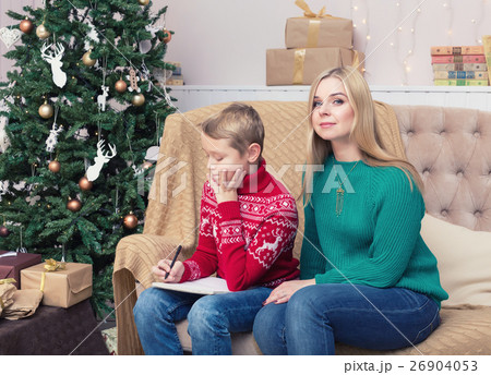 Happy mother and her son writing letter to Santa 26904053