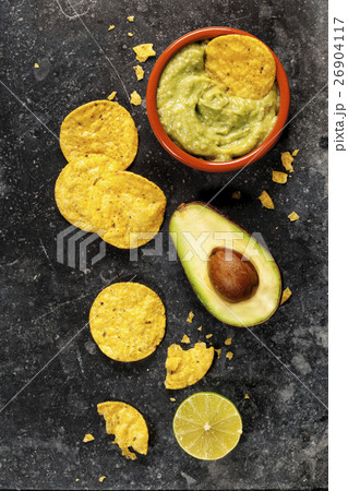 Mexican nachos chips with homemade fresh guacomole Mexican nachos chips with homemade fresh guacomole 26904117
