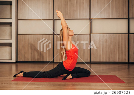 woman in a traditional yoga pose 26907523