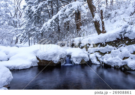 Waterfall and river on the forest in winter. Waterfall and river on the forest in winter. 26908861