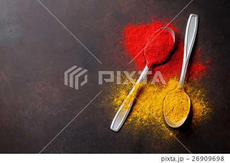 Various spices spoons on stone table Various spices spoons on stone table 26909698