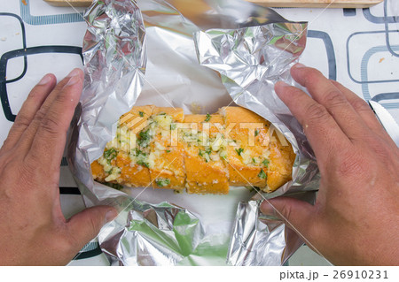 Wrap sausage bread with foil Wrap sausage bread with foil 26910231