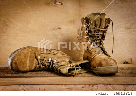 old military boots on the table 26913813
