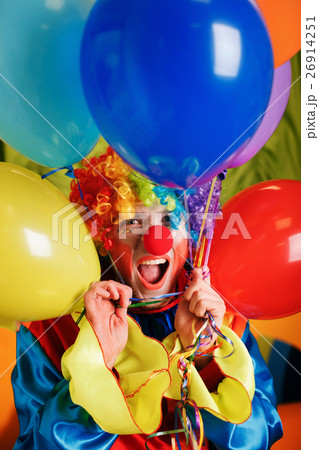 Clown with a bunch of colorful air balloons. 26914251