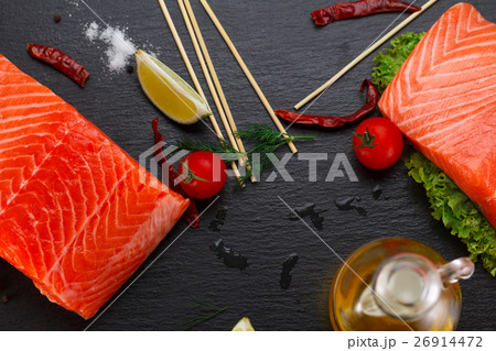 salmon fillet and tomatoes, lime and chili pepper 26914472