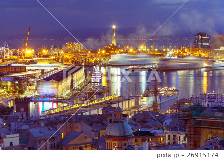 Old Lighthouse in port of Genoa at night, Italy. 26915174