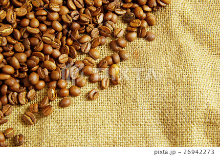 coffee beans on burlap background coffee beans on burlap background 26942273