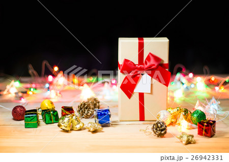 Gift box and blinker on wooden background 26942331