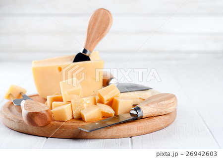 Various types of cheese on a plate 26942603
