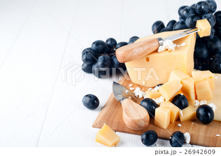 Various types of cheese on a plate 26942609