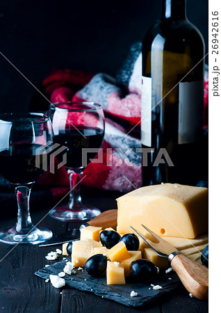 two glasses of red wine and cheese 26942616