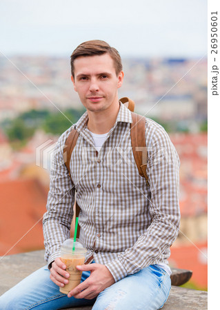 Young urban man drinking coffee background 26950601