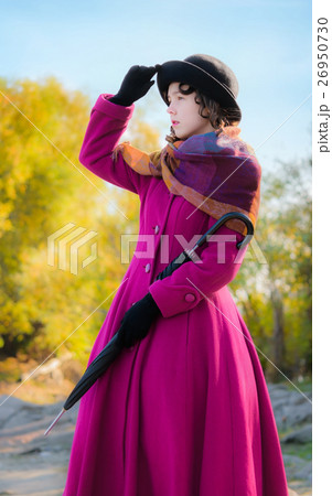 girl in a crimson coat looks into the distance 26950730
