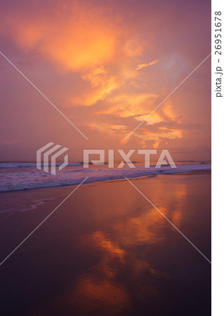 Sunset clouds and waves on empty beach Sunset clouds and waves on empty beach 26951678
