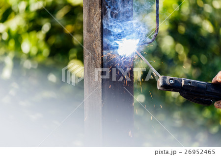 Welder in factory welding metal . 26952465