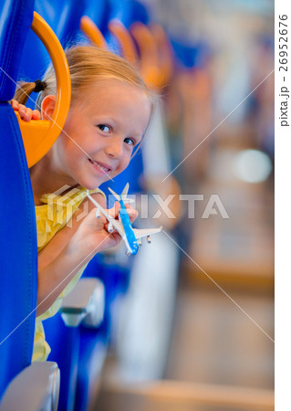 Adorable little girl traveling on train and having Adorable little girl traveling on train and having 26952676