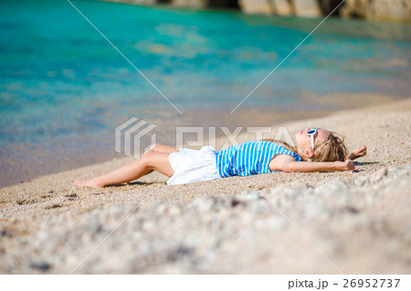 Adorable little girl at beach during vacation in Adorable little girl at beach during vacation in 26952737