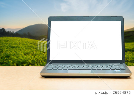 Laptop with blank screen with blur green nature 26954875