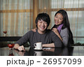 Young couple at cafe smiling 26957099