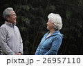 A senior couple in sweatsuits talking together 26957110