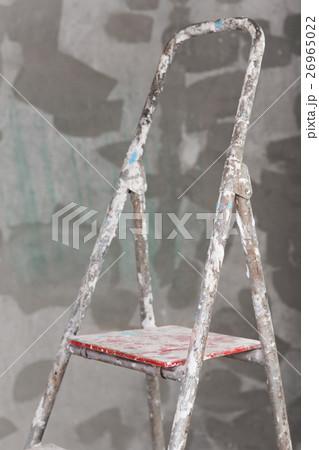Old painted and stucco ladder on concrete wall 26965022