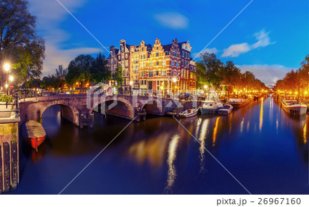 Night city view of Amsterdam canal and bridge Night city view of Amsterdam canal and bridge 26967160