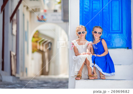 Cute little girls at street of typical greek 26969682