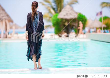Young beautiful woman on beach vacation Young beautiful woman on beach vacation 26969931