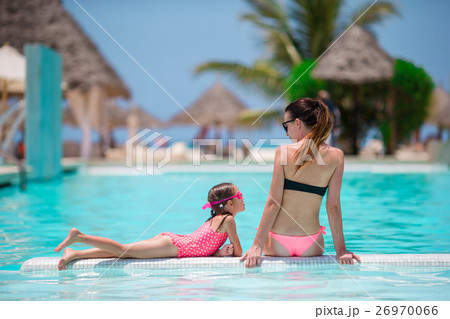 Young mother and little daughter have fun on the 26970066