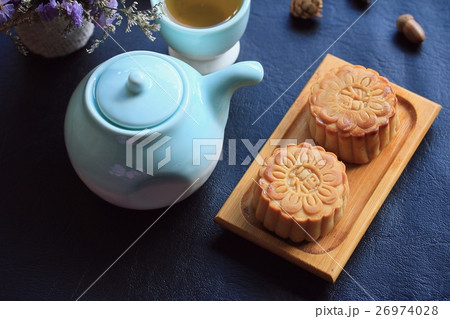 Festival moon cake and hot tea - Chinese cake Festival moon cake and hot tea - Chinese cake 26974028