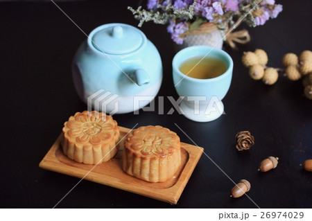 Festival moon cake and hot tea - Chinese cake Festival moon cake and hot tea - Chinese cake 26974029