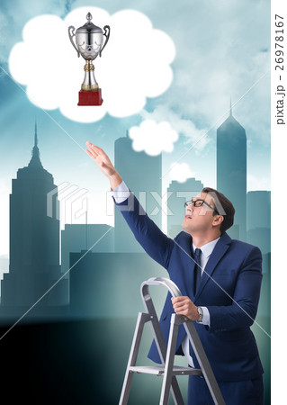 Businessman climbing towards his business goal 26978167