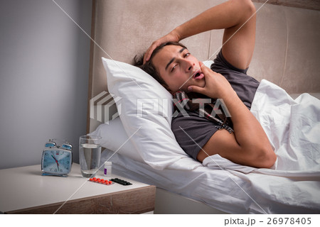 Sick man resting in the bed 26978405