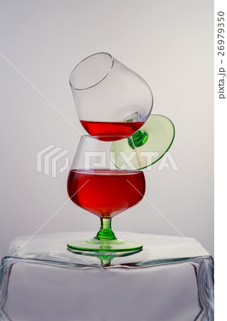 Two glasses of brandy or cognac wooden table. 26979350