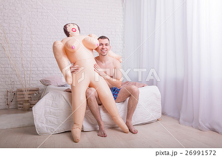 Man put sex doll on his knees. Man put sex doll on his knees. 26991572
