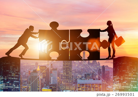 Business concept of teamwork with jigsaw puzzle Business concept of teamwork with jigsaw puzzle 26993501