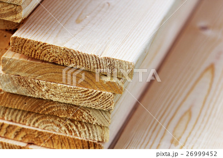 Pile of new wooden boards on a storage Pile of new wooden boards on a storage 26999452