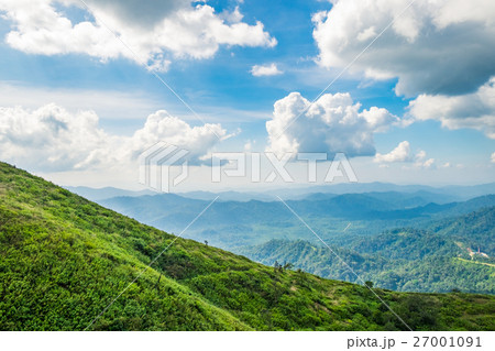 Green mountain peak slope bright sky 27001091