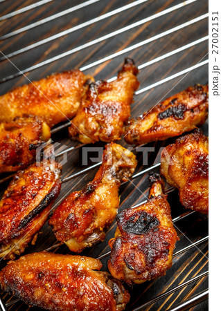 Grilled chicken wings on the grill Grilled chicken wings on the grill 27002151