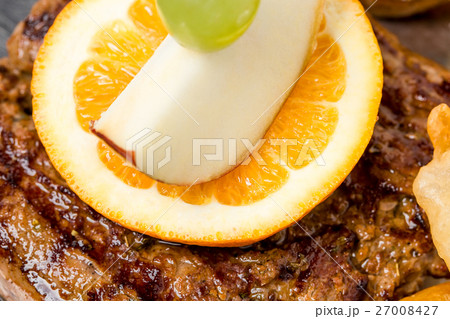 Grilled pork steak with garnish. Grilled pork steak with garnish. 27008427