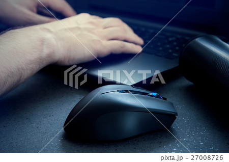 gaming mouse with man using computer at night. 27008726