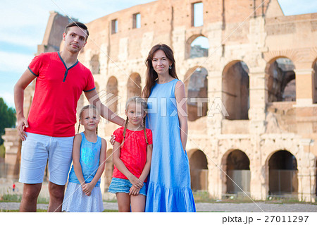 Happy family of four at italian vacation on 27011297