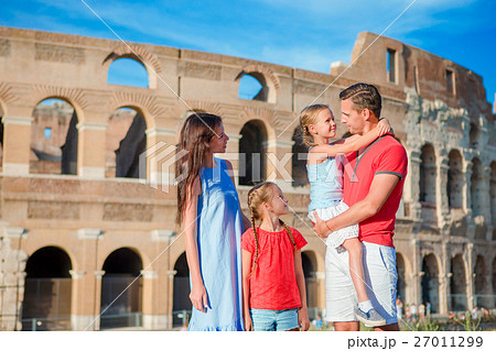 Happy family of four at italian vacation on 27011299