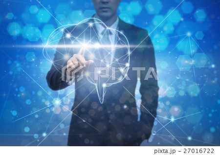 Businessman hand pointing the brain over the Abstract Hexagon bokeh background on blue color background, technology and healthty concept Businessman hand pointing the brain over the Abstract Hexagon bokeh background on blue color background, technology and healthty concept 27016722