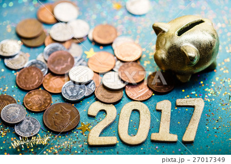 piggy bank and pound GBP coins piggy bank and pound GBP coins 27017349